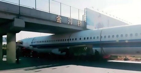 Flight got stuck under a bridge in china | Oneindia Malayalam