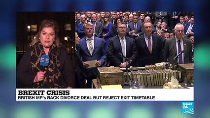 British MPs back divorce deal but reject exit timetable