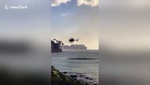 Dramatic moment helicopter collects ocean water to douse fire at Hawaiian airport