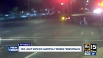 Red-light runner nearly hits family pushing stroller