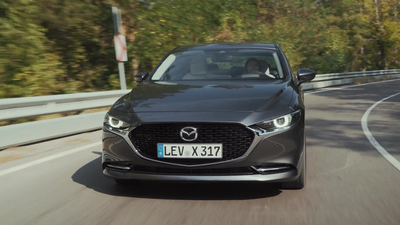 All-New Mazda3 Skyactiv-X Sedan in Machine Grey Driving in Bulgaria