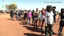 Climbers Form Long Lines On Australia’s Uluru Before Climbing Ban Takes Effect!