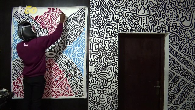 Nigerian Artist Creates His Own Unique Art Form While Wear Mask That Inspires Him!