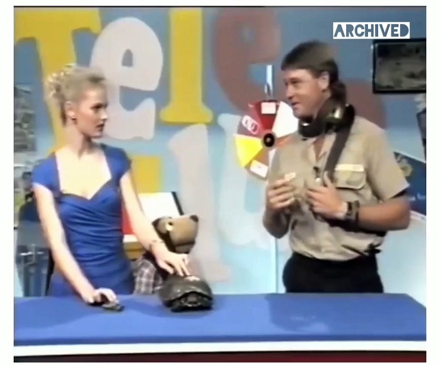 Steve Erwin staying calm while being bit  by a snake