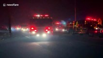 Dozens of fire trucks arrive to tackle spreading California fire