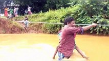 Children risk lives to cross flooded river just to get to school