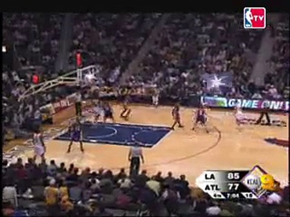 Josh Smith dunks over  Lakers's Ronny Turiaf.