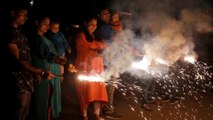 Hindus across India celebrate Diwali festival of lights with firecrackers and candles