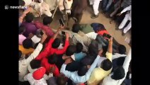 Indian villagers allows themselves to be trampled by stampeding cattle for post-Diwali festival