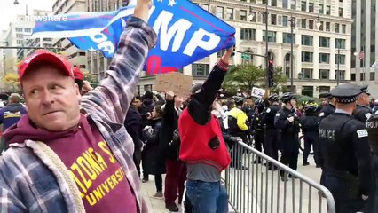 Pro and anti-Trump protesters clash on the streets of downtown Chicago