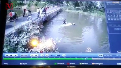Footage Shows Dad Trying To Save His Kid After His Car Gets Knocked Off A Bridge