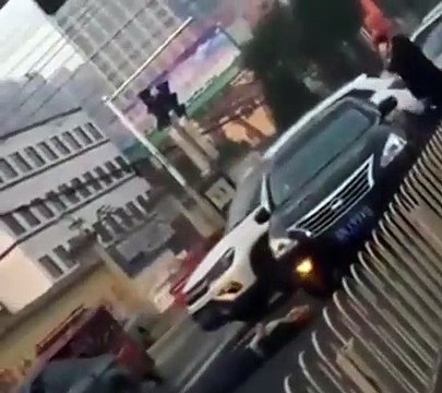 Insurance scammer pretending to be hurt in the middle of traffic