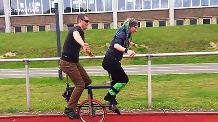 Duo attempt to ride two-seated unicycle in Germany