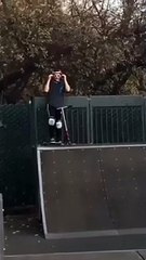 Scooter Rider Does A Trick On A Quarter Pipe And Fails