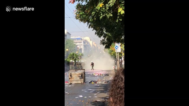 Street fires burn in Greece amid running battles between anarchists and riot police