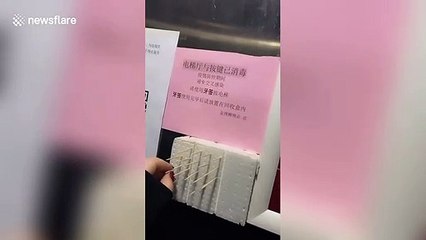 Toothpicks provided in lift so Chinese residents don't have to touch buttons to prevent spread of coronavirus