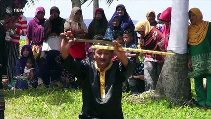 Showmen in Indonesia show off gruesome 'weapon immunity' skills