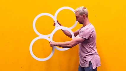 Circus performer creates an optical illusion with rings