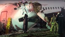 Plane breaks apart after crash-landing in bad weather