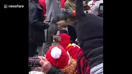 Lombardi luge! Super Bowl champ Travis Kelce chugs beer sliding down trophy at Kansas City championship parade