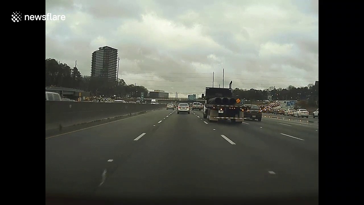 Dashcam footage shows moment tree crashes onto highway as storms rip through Atlanta