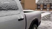 Motorist finds car covered in thick sheet of ice as snowstorm hits Canada