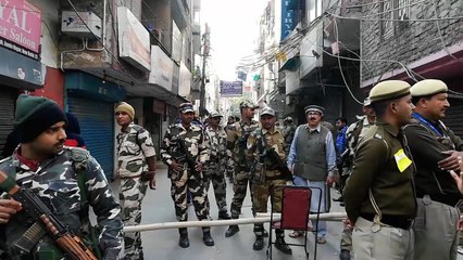 Security forces march through Shaheen Bagh as polling continues in Delhi