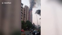 Fire breaks out in top floors of Mumbai apartment complex after gas cylinder explosion