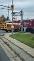 School Bus Comes Uncomfortably Close to Train