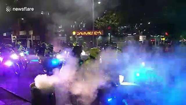 Students clash with riot police in Bogota