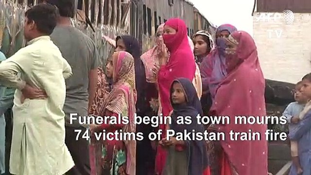 Funerals begin as town mourns victims of Pakistan train fire