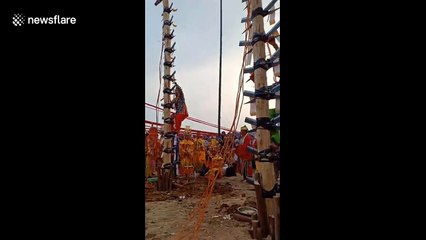 Vietnamese men complete challenge climbing on knives barefoot