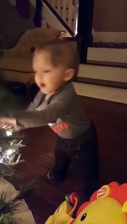 Little Kid Falls While Playing With The Christmas Tree