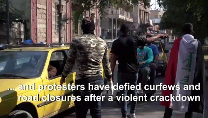 Blocking police at checkpoints, Iraqis revel in people power