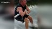 Man struggles and hilariously fails to waterski barefoot