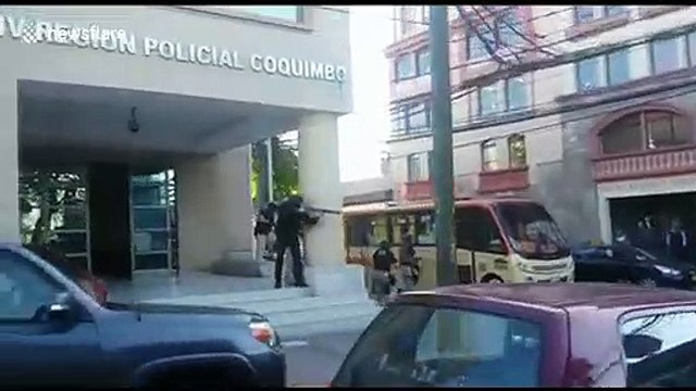 Armed Chilean police attack protestors