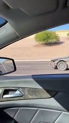 Half a Car Drives down Highway