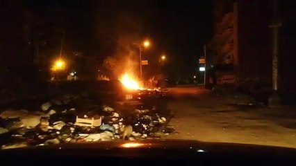 أهالى منشية البكرى بالمحلة يشكون من إشعال النيران فى تلال القمامة