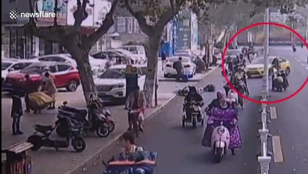 Chinese driver thrown out of car after pressing accelerator by mistake