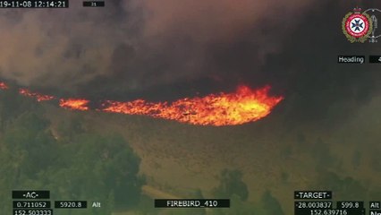 Aerial footage shows a wall of fire and smoke burning in Jimna