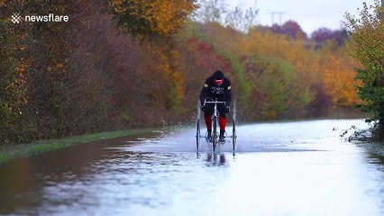 Man on TRICYCLE tackles floods in West Yorkshire, England