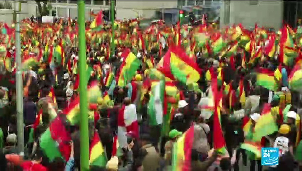 Bolivians react to the resignation of President...