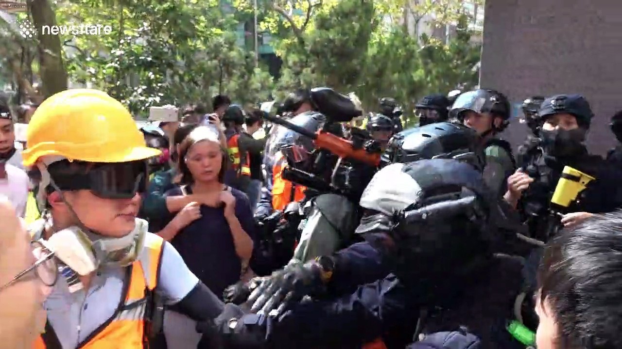 Hong Kong police shoot protesters with pepper spray pellet gun a near point-blank range