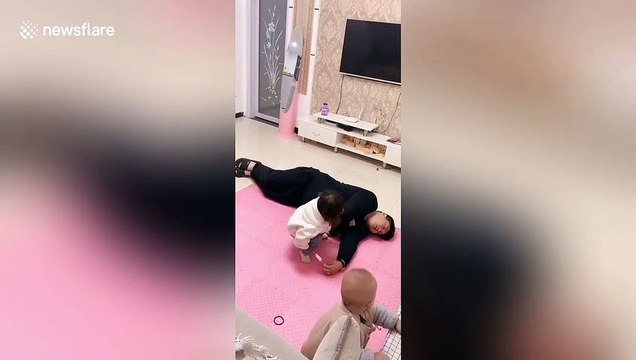 Two-year-old girl steals ice lolly from father after he pretends to faint in China