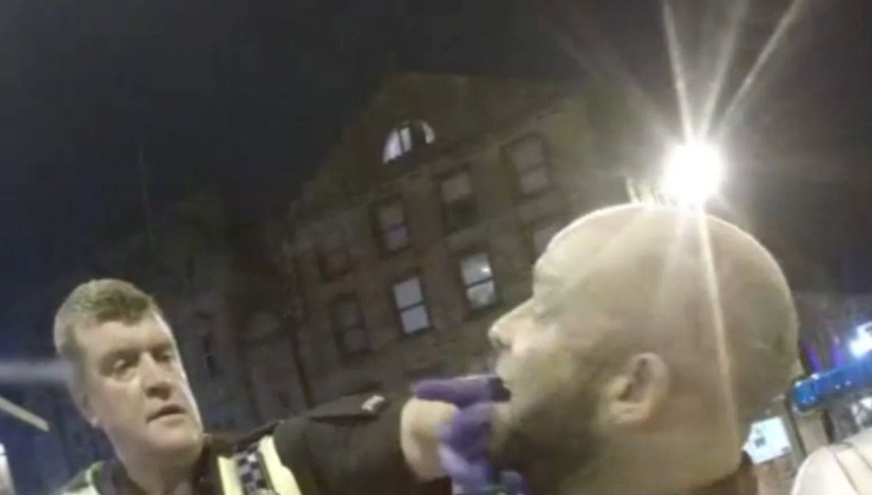 Shocking video of man biting  police officer in Halifax