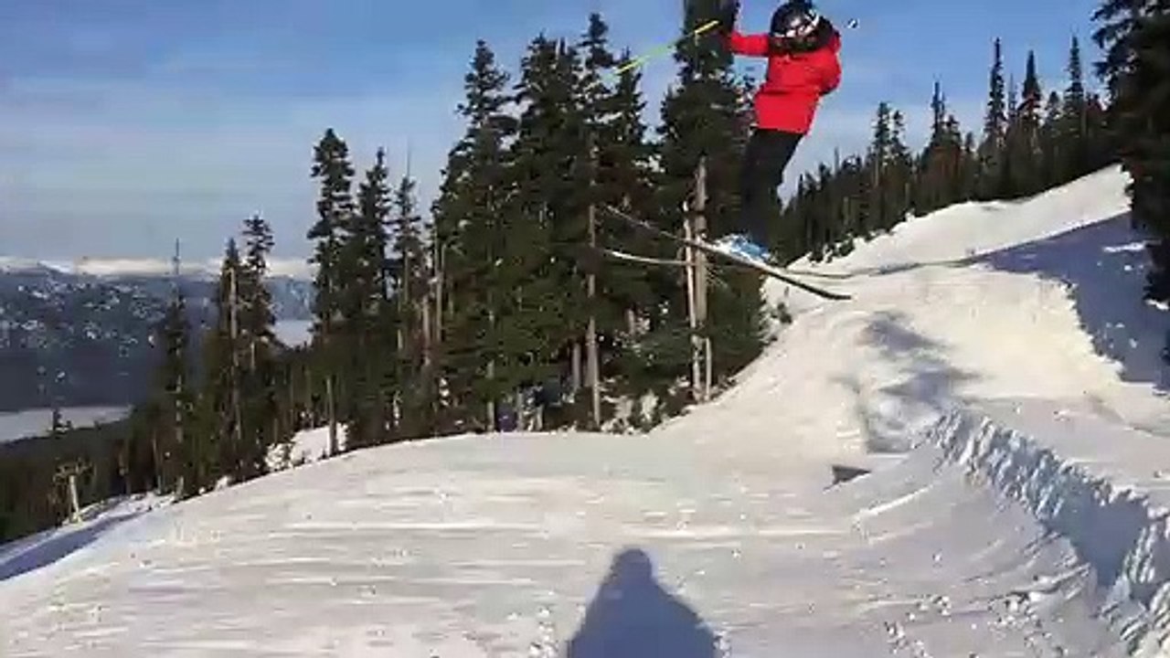 Skier Jumps A Ramp And Falls Out Of His Skiis