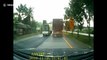Articulated truck topples over after trying to avoid another overtaking truck in Thailand