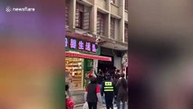 Chinese toddler luckily lands on canopy after falling from first floor of building