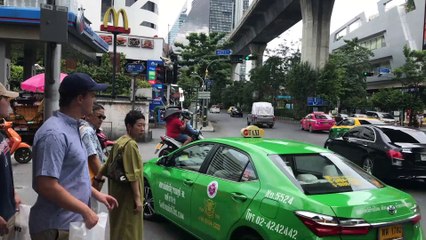 Tourist Rides Motorcycle With Chair On His Head