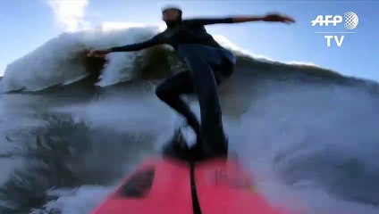 Surf's up: French surfer catches huge wave in Portugal